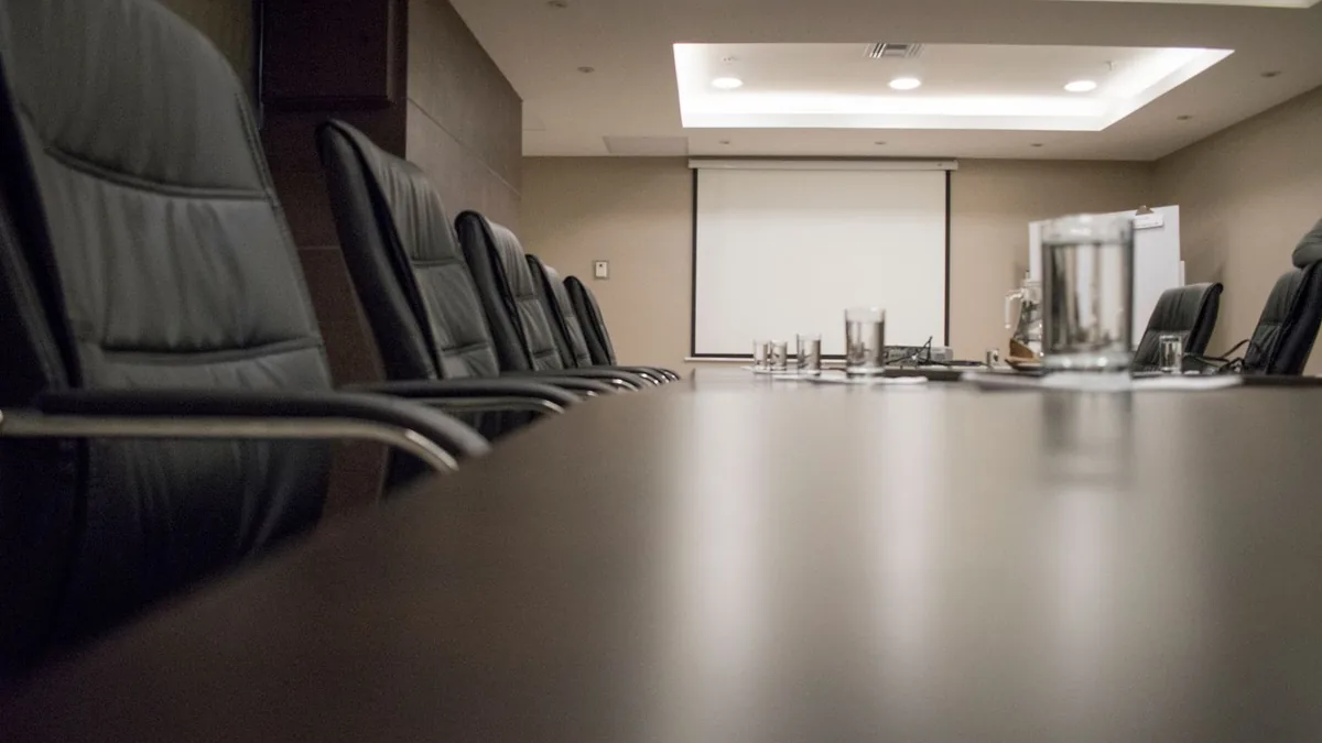 Empty boardroom with leather chairs, where fractional executive firms for MSPs meet leadership teams