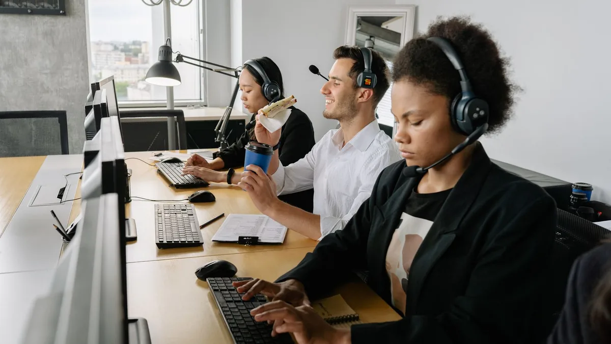 Appointment setters on headset calls booking meetings for MSP lead generation