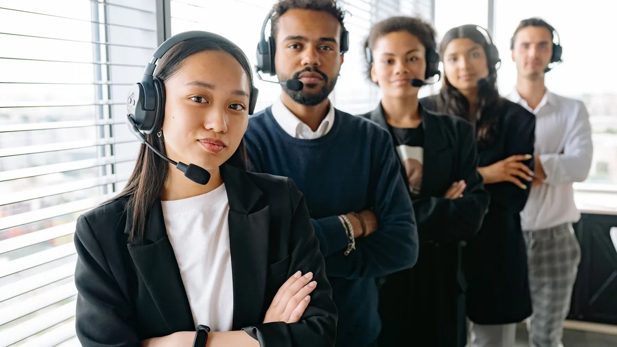 Lead generation team wearing headsets, the kind of outbound team MSPs hire