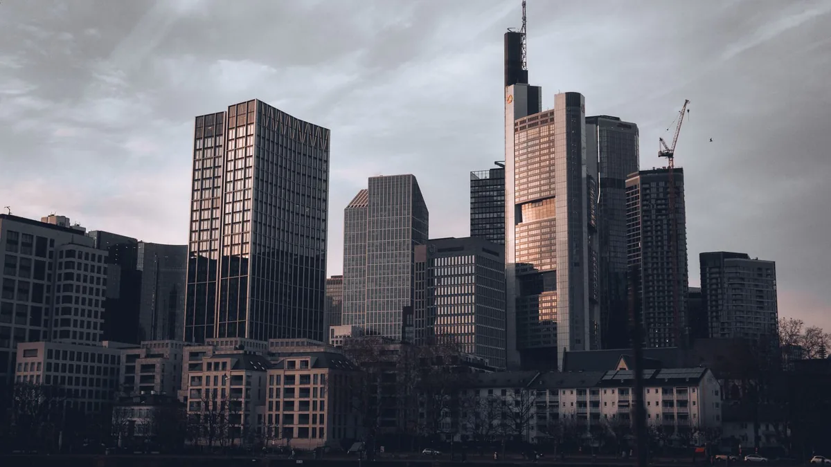 City skyline of office towers representing the M&A market for MSP business brokers