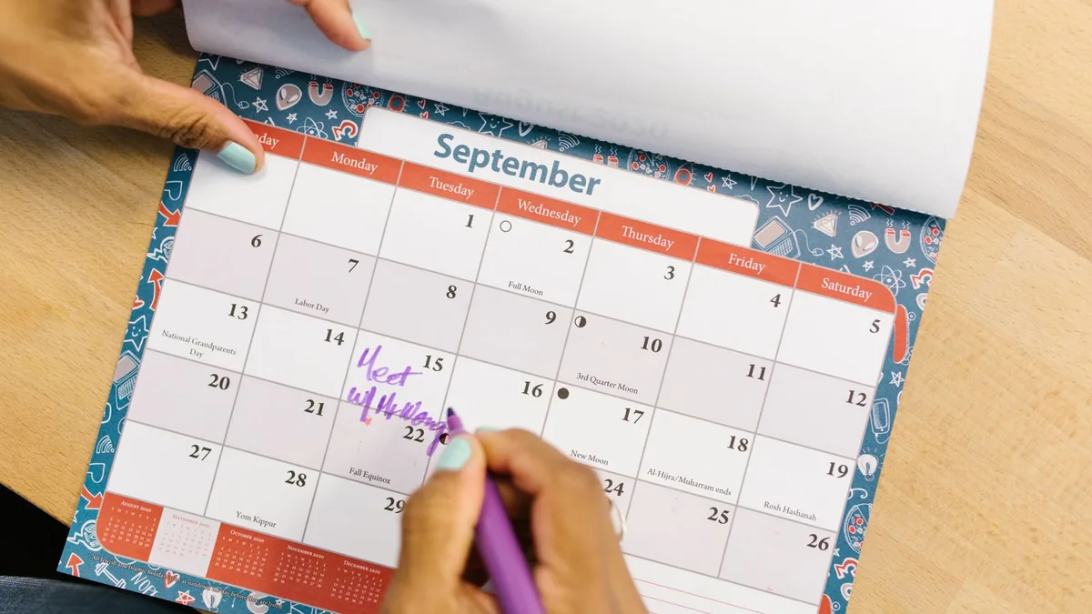 Marking a booked meeting on a September calendar for MSP appointment setting