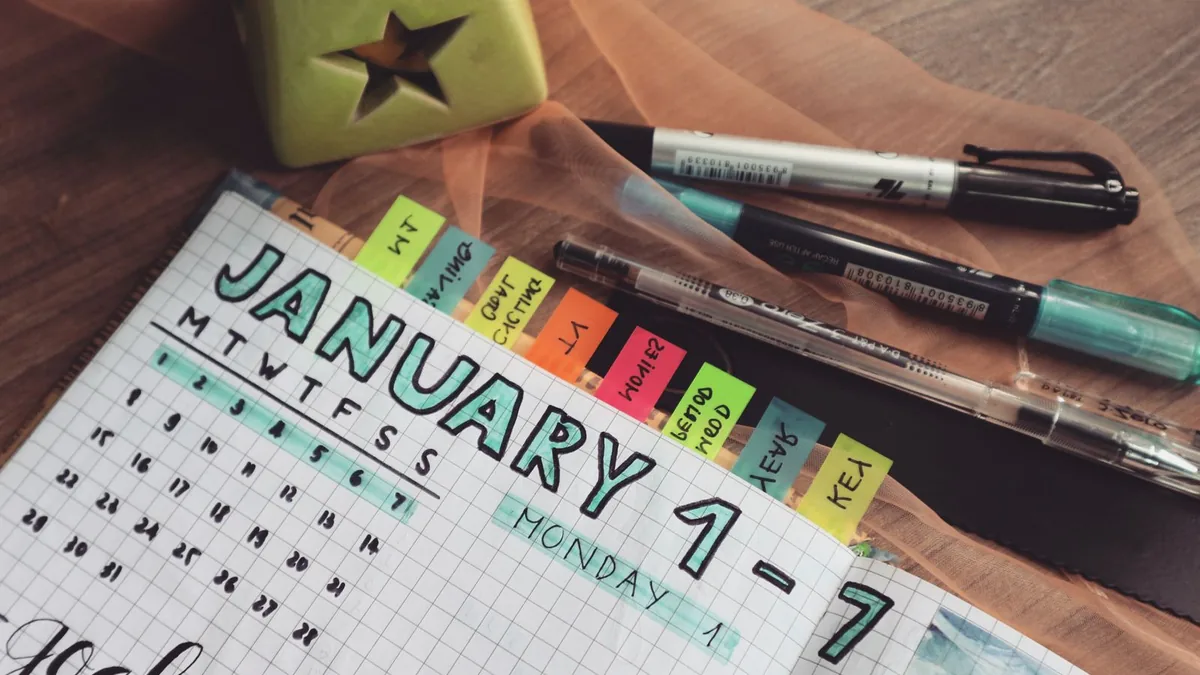Weekly planner with colored tabs used to organize MSP appointment setting