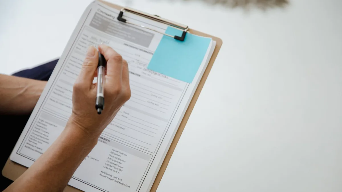 The SOPs every MSP marketing team needs: a checklist on a clipboard being filled out