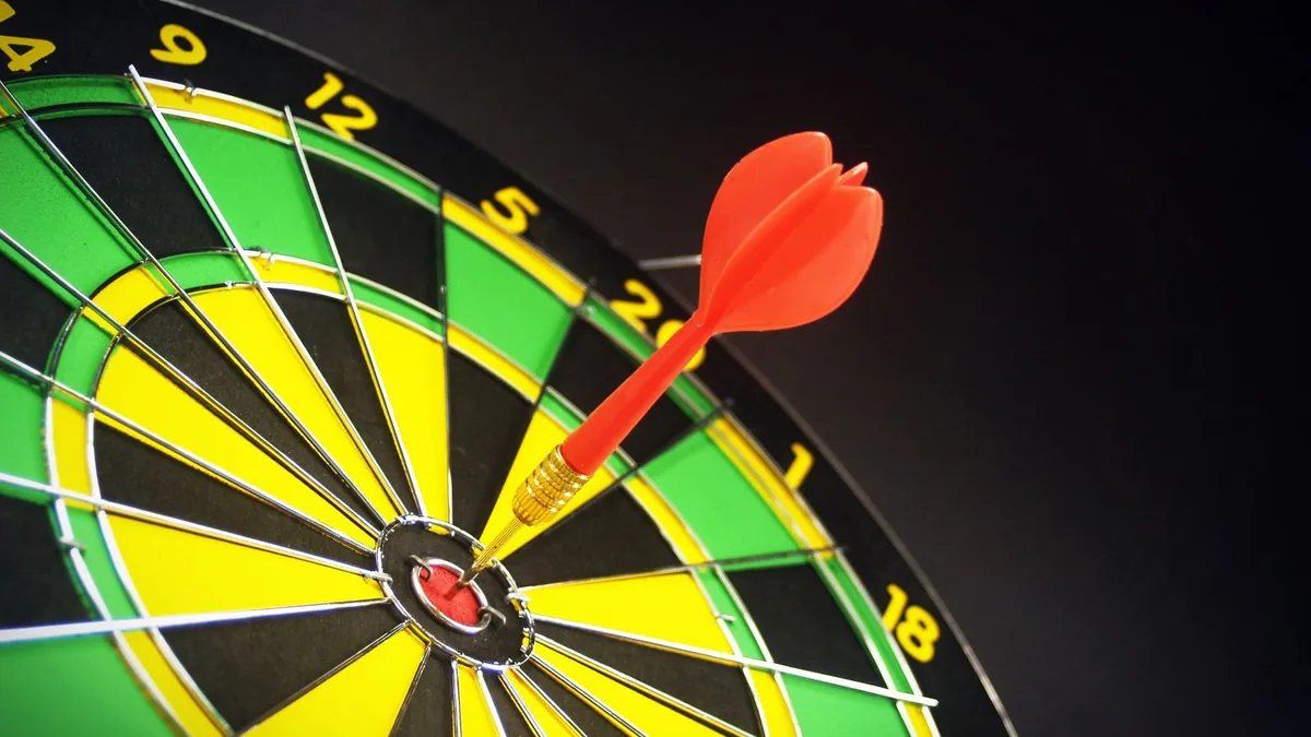 A red dart in the bullseye of a dartboard, the kind of precision MSP outbound prospecting aims for