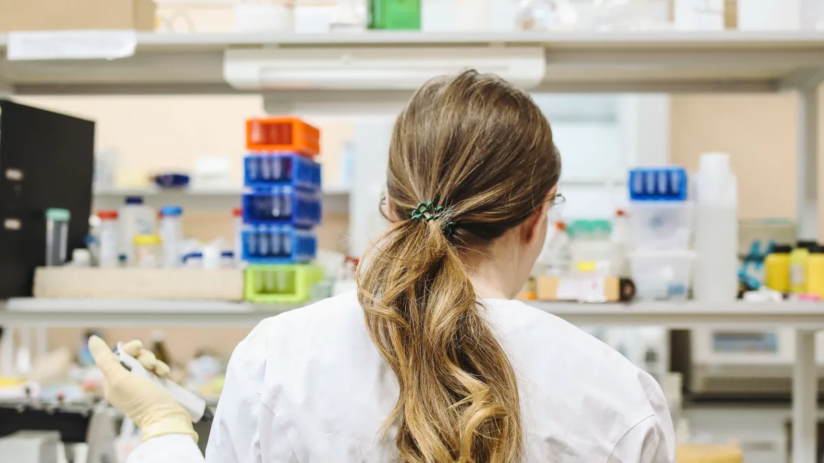 How to apply for SBIR funding as a research-driven small business: a scientist at work in a lab